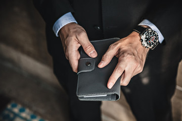 Men's hands with wallet