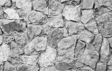 Grey stone wall background. Natural stone brick wall.