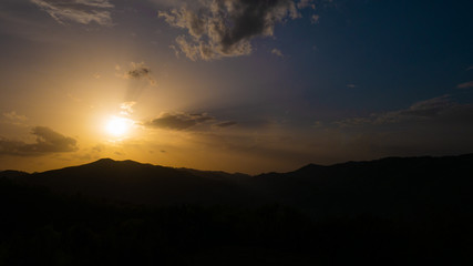 Obraz premium Beautiful landscape in the mountains at sunset. View of colorful sky with amazing clouds.