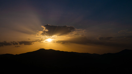 Beautiful landscape in the mountains at sunset. View of colorful sky with amazing clouds.