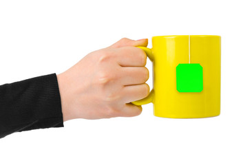 Hand with cup of tea