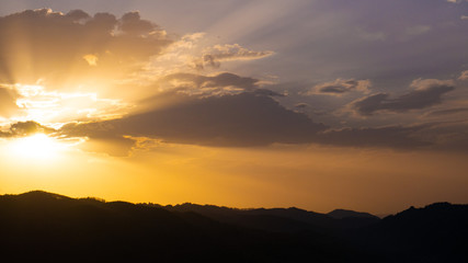 Beautiful landscape in the mountains at sunset. View of colorful sky with amazing clouds.
