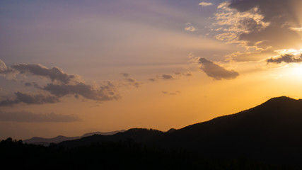 Beautiful landscape in the mountains at sunset. View of colorful sky with amazing clouds.