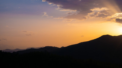 Beautiful landscape in the mountains at sunset. View of colorful sky with amazing clouds.
