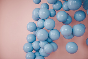 Blue balls on a pink background. Wedding or birthday decoration. Bright background