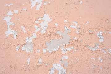 Old wall with two layers of peeling paint.