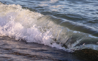 Waves on the seashore as an abstract background