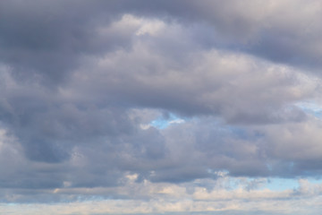 Clouds against the blue sky as a background