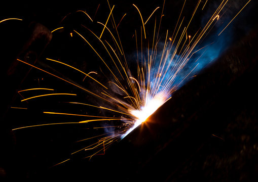 Sparks From Welding At A Construction Site As A Background