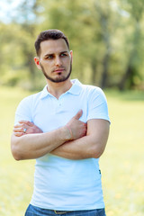 Handsome young man in white t-shirt outdoor in. Lifestyle, human.