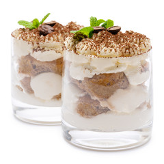 two portions Classic tiramisu dessert in a glass isolated on a white background with clipping path