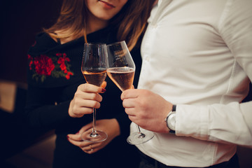 a young couple, a romantic dinner in the restaurant, serve champagne and the lady is asked for marriage. Valentine's Day, congratulations and anniversary.