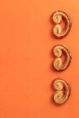 Puff pastry cookies on colorful background