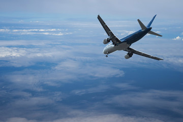 Airplane over the clouds,