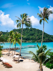 Long wooden bridge amidst the beautiful blue sea on the beach in the tropical island - Koh Kood, Trat province.