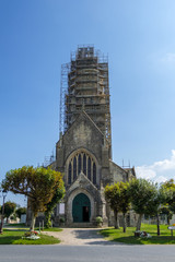 Sainte-Marie-du-Mont, France - August 16, 2018: The church of Notre-Dame of the Assumption in Sainte-Marie-du-Mont. Normandy, France