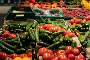 Cucumbers and tomatoes on the counter in the store