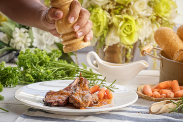 lamb steak on white plate