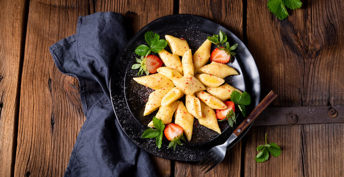 Kopytka - polish potato dumpling with strawberries