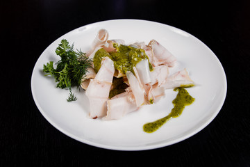 Lard. Strips of fat with copy space. Pork fat slices on a wooden plate, copy space