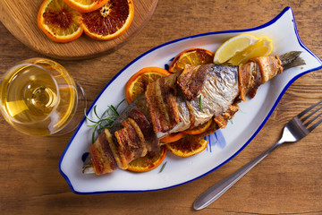 Grilled Bacon-Wrapped Whitefish. Fish wrapped with bacon. View from above, top