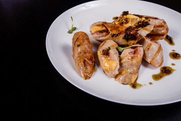 Spicy chicken fillet baked with bacon, tomatoes and cheddar cheese