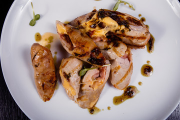 Spicy chicken fillet baked with bacon, tomatoes and cheddar cheese