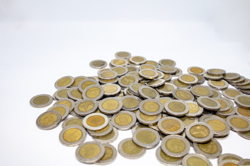 Currency in Thai baht Coin with golden and silver color on white background. Abstract of saving money