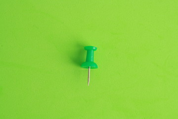 plastic thumbtacks in colorful background