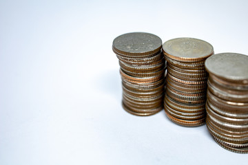 Currency in Thai baht with silver coins on white background. Abstract of saving money