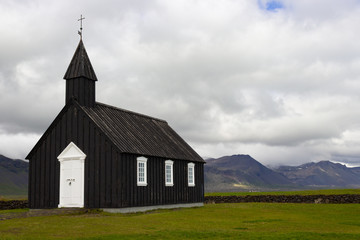 Fototapeta na wymiar Budakirkja black church - popular tourist attraction of Iceland, located at a hamlet of Budir, Snafellsnes peninsula Iceland, Europe