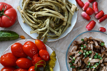 Pickled tomatoes, mushrooms, tumbleweed and fresh vegetables. Pickled russian thistle, mushrooms, tomatoes