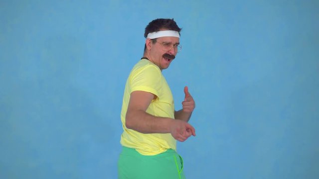 Portrait of funny man trainer with a mustache from the 80's on a blue background