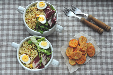 Noodles with broth, salad and quail eggs. Healthy lunch or dinner. Dietary nutrition. Vegetarian food. Keto diet