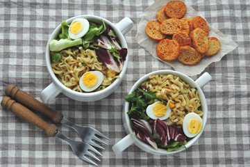 Noodles with broth, salad and quail eggs. Healthy lunch or dinner. Dietary nutrition. Vegetarian food. Keto diet