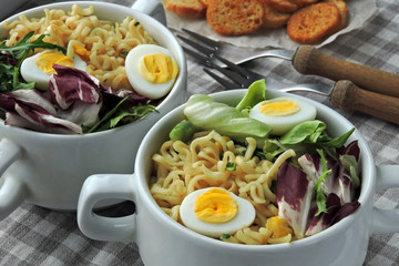 Noodles with broth, salad and quail eggs. Healthy lunch or dinner. Dietary nutrition. Vegetarian food. Keto diet