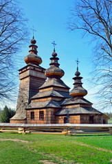 Fototapeta na wymiar Beautiful ancient greek catholic wooden church in village of Kwiaton in spring, inscribed on the UNESCO World Heritage list, Low Beskids (Beskid Niski), Poland