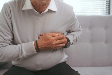 Old asian man has a sudden heart attack