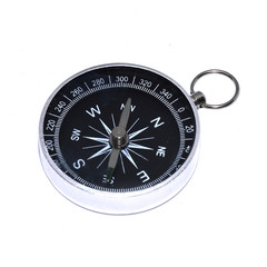 Detailed view of a magnetic compass silver and black color, isolated on white background. 