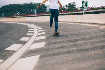 Skateboarder skateboarding  on city road