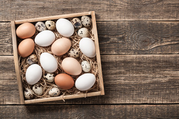 Fresh rustic eggs in wooden box