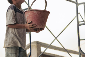 Child labor in building commercial building structures.