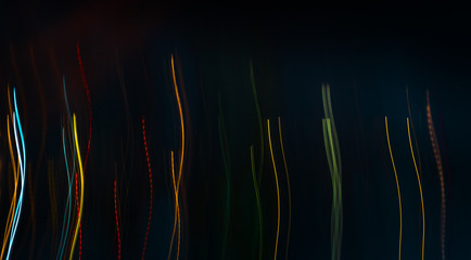 streaks of colorful lights on a black background