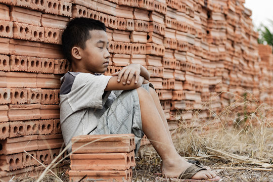 Child working in a brick factory. world day against child labor concept