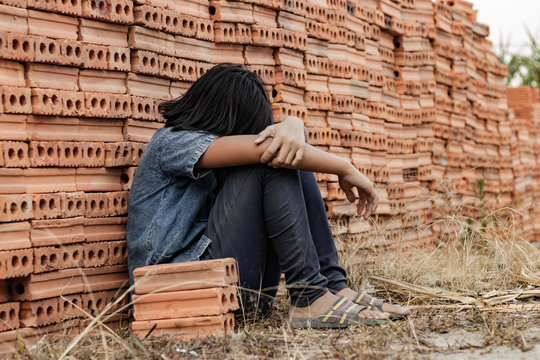 Child working in a brick factory. world day against child labor concept
