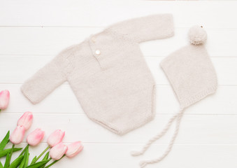 Composition of knitted suit and hat