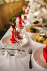 Restaurant interior, serving, wine and water glasses, plates. Concept banquet, birthday, conference, group lunch