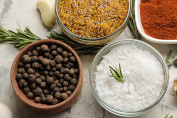 herbs and spices. various seasonings, herbs and spices on a light concrete background. top view