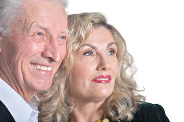 Portrait of happy senior couple hugging isolated