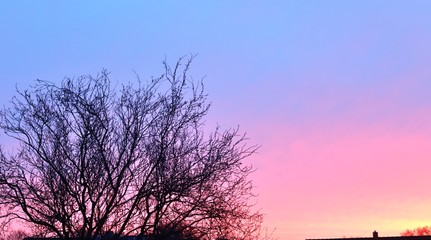Beautiful sunset cloud formations on a orange and blue sky 